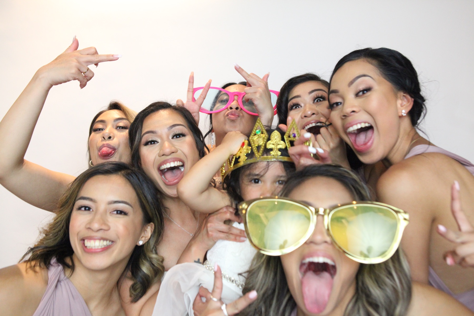 Friends share a candid photo booth moment