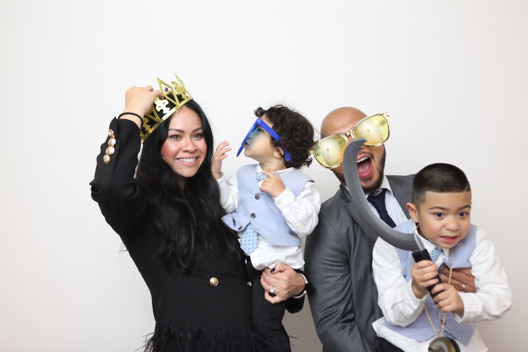 A family makes a playful photo booth portrait